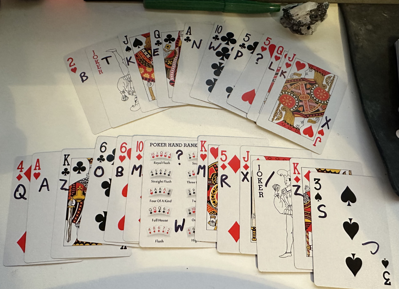 playing cards with letters inscribed